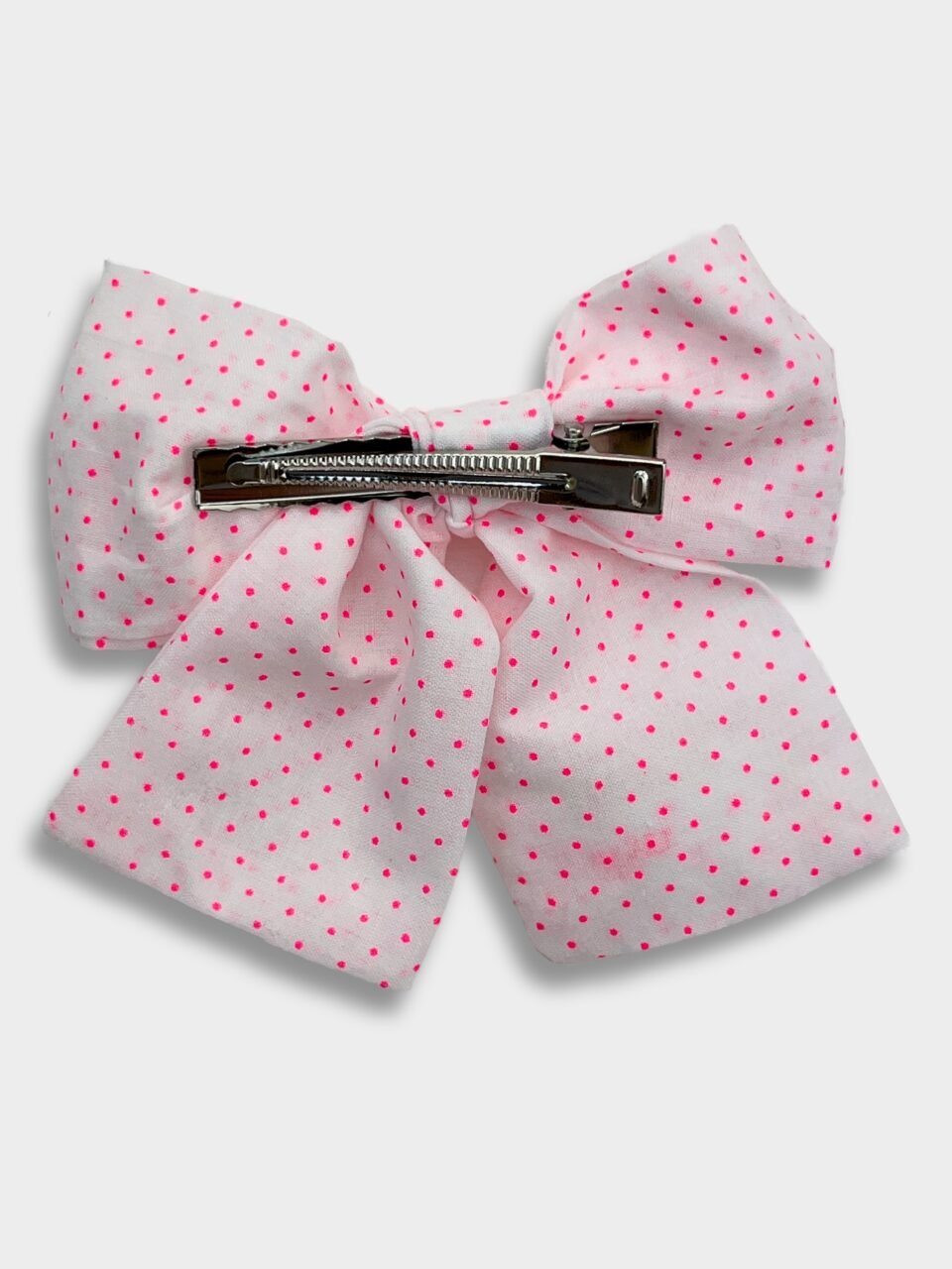 barrette gros noeud à pois rose fluo